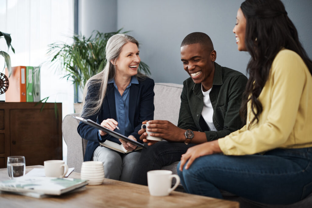 IT consultant advising a couple on cybersecurity, data protection, and secure technology planning for their home office.